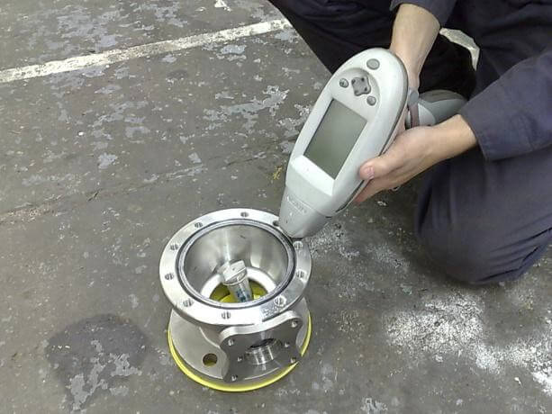 Positive-Material-Identification-Pmi Technician performing ultrasonic test on Super Duplex 32750 plate surface